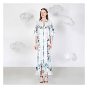 Woman wearing a floral dress with a white background